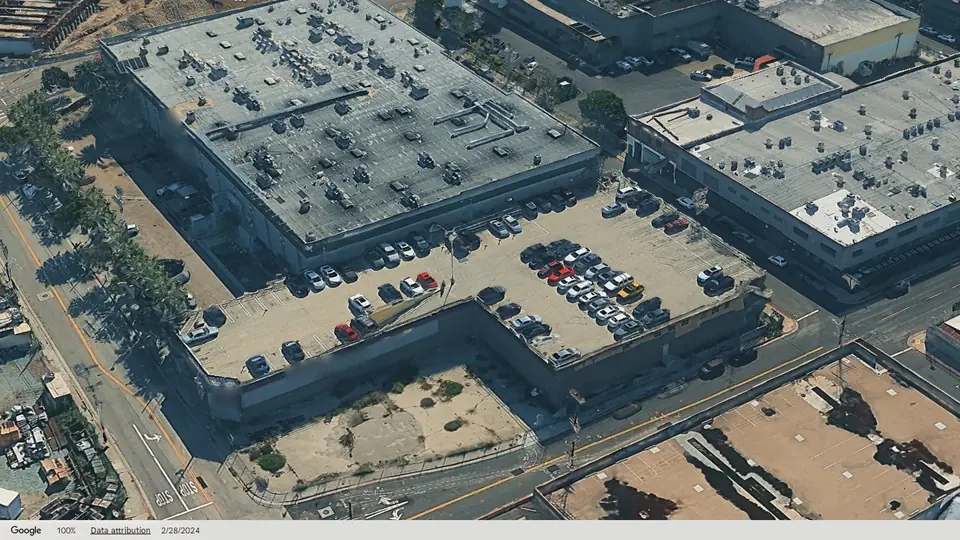 3D aerial view of the Commercial St Warehouse and its rooftop parking deck at Vignes St and Commercial St in the Arts District