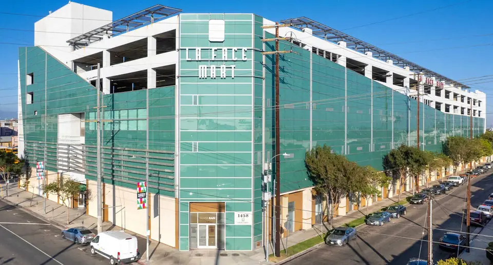 LA Face Mart, a multi-level building with a green glass façade at the corner of S San Pedro St in the Downtown Los Angeles Fashion District