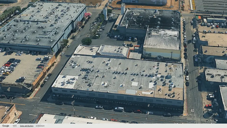 3D aerial view of The Arts industrial building in the Los Angeles Arts District, looking east